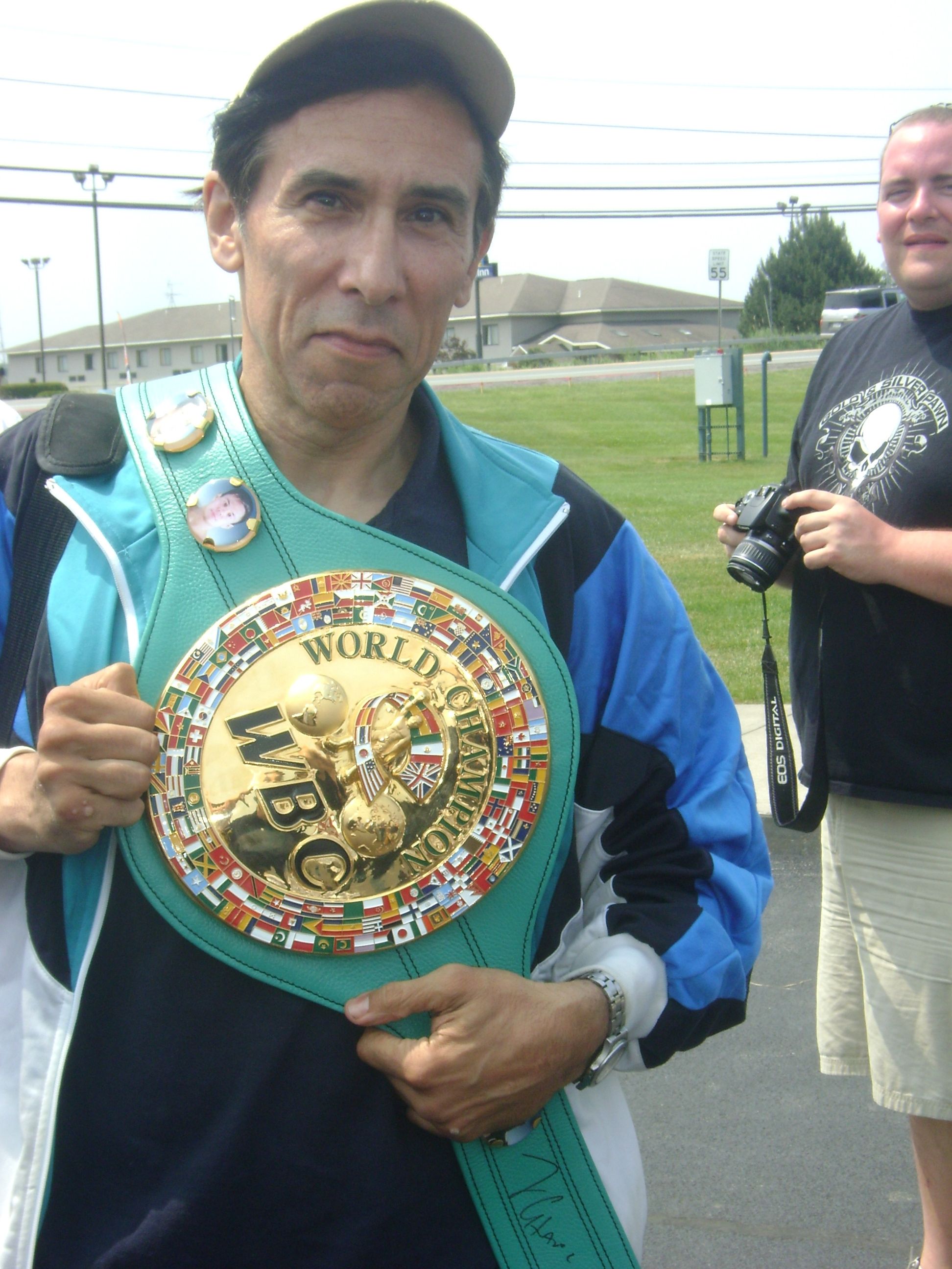 Fan posing with title belt